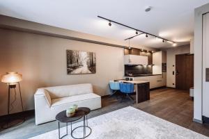 a living room with a couch and a table at Dillhof Apartments in Eschau