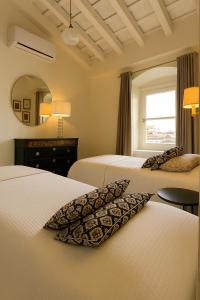 Ένα ή περισσότερα κρεβάτια σε δωμάτιο στο La Bohéme