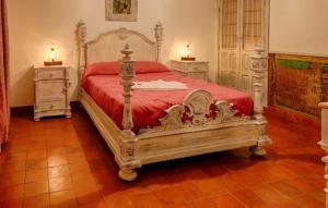 a bedroom with a large bed and two night stands at Casa Matías in Almagro