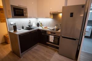 Η κουζίνα ή μικρή κουζίνα στο Cozy flat in center +6 φωτογραφίες