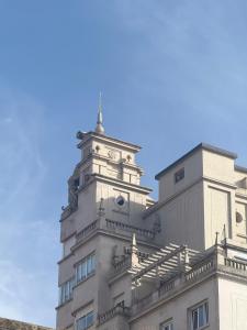 a building with a clock tower on top of it at Vigo Central Retreat in Vigo