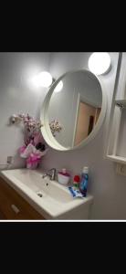 a bathroom with a sink and a mirror at Vigo Central Retreat in Vigo