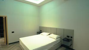 Shox Reabilitatsiya va Sanatoriya markaziにあるベッド