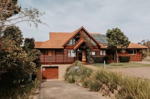 a house with solar panels on top of it at Forest Hideaway In Knysnas Phantom Pass in Knysna