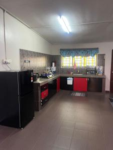 Η κουζίνα ή μικρή κουζίνα στο ORKiD HOMESTAY