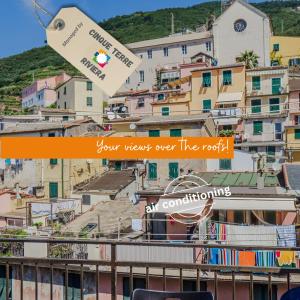 a view over the roofs of a town with buildings at La Maison de la Mer with Terrace and AC in Vernazza