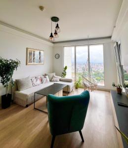 a living room with a couch and a table at BlueSky 31 in Skopje