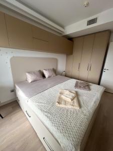a bedroom with a bed with a tray on it at BlueSky 31 in Skopje +11 photos