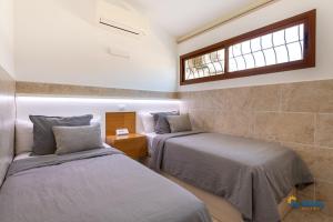 Postel nebo postele na pokoji v ubytování Villa Sun Paradiso + 20 fotografií