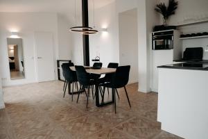 a dining room with a table and chairs at EmsQuartier in Norderney