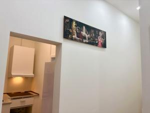 a picture hanging on the wall of a kitchen at City Line Koblenz in Koblenz