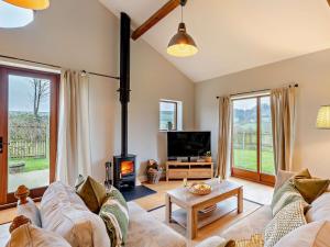 a living room with a couch and a fireplace at 3 Bed in Corton Denham 44051 in Pointington