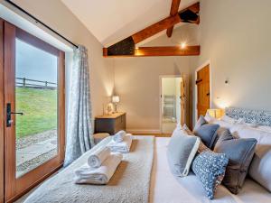 a living room with a bed and a large window at 3 Bed in Corton Denham 44051 in Pointington