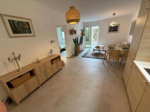 a kitchen and dining room with a dining table at Ambijent in Sesvete