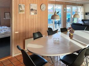 a dining room with a table and chairs at 4 star holiday home in Nordborg in Nordborg
