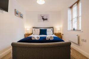 Ένα ή περισσότερα κρεβάτια σε δωμάτιο στο Charming 2 Bedroom Home in the Cotswolds