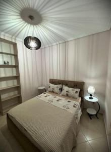 Postel nebo postele na pokoji v ubytování 5 Star Apartment