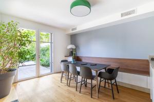 a kitchen and dining room with a table and chairs at Spacious house with garden in Toulouse in Toulouse