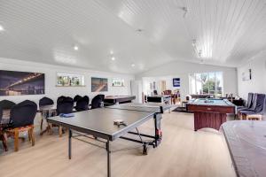 a room with a ping pong table and pool tables at Lønstrupvej 46B 10 Pax in Gølstrup