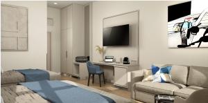 a hotel room with a bed and a desk with a couch at Oysters & Bubbles Gastro Rooms Rynek Square in Poznań