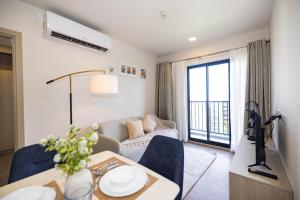 a living room with a couch and a table at Entire apartment in Kathu, Phuket, Thailand in Kathu