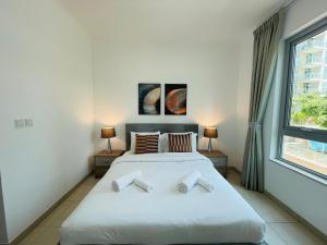 Postel nebo postele na pokoji v ubytování Residences 1 Tower 5 E2 - 2BR Apartment - Allsopp & Allsopp + 15 fotografií