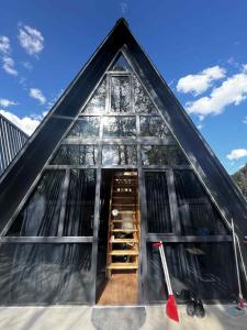 a small house with a staircase in the front of it at Chalet Adjara 