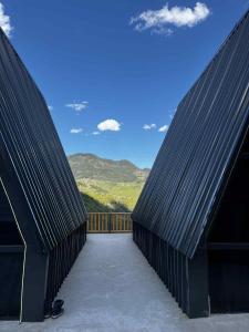 two black roofs of a house with a view at Chalet Adjara 