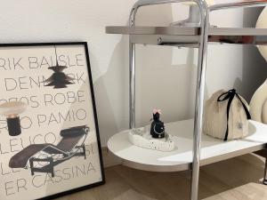a shelf with a mirror and a shelf with a chair at Busan manoah stay hotel in Pusan +47 photos