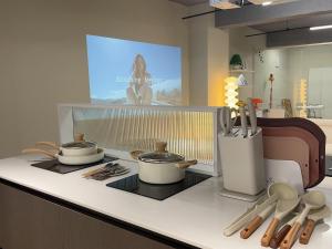a kitchen with two pots and pans on a counter at Busan Manoah Stay in Busan