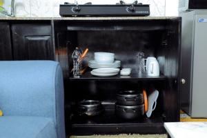 Η κουζίνα ή μικρή κουζίνα στο Lion's Den Studio Apartment near town -A hidden Gem