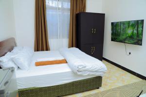 Ένα ή περισσότερα κρεβάτια σε δωμάτιο στο Lion's Den Studio Apartment near town -A hidden Gem