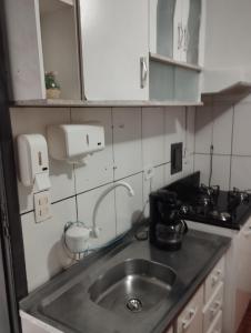 Η κουζίνα ή μικρή κουζίνα στο Espaço Ideal 3 +8 φωτογραφίες