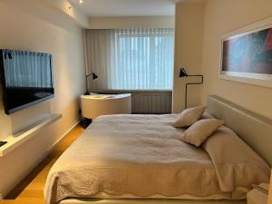 En eller flere senge i et værelse på Akmerkez Residence