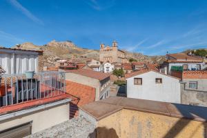 a view of a city from the roofs of buildings at Casa Maluenda in Maluenda