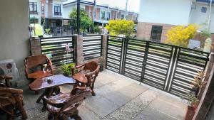 a table and two chairs sitting on a balcony at Rosalia's in Matina in Davao City