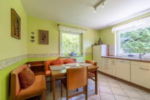 a kitchen with a table and a dining room at Nordstern 3 in Dahme