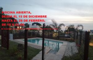 a view of a swimming pool from a building at APART HOTEL Atardecer in Atlántida