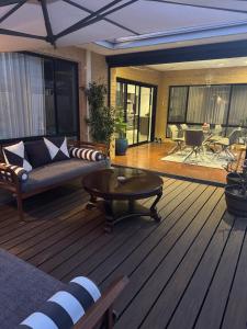 a living room with a couch and a coffee table at The Lux Dip in Perth