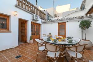 an outdoor patio with a table and chairs at Casa Atriana by Marhen Homes in Jávea