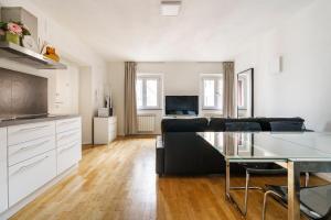 a living room with a couch and a table at CDT Duomo in Florence