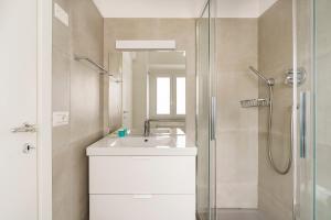 a bathroom with a sink and a shower at CDT Duomo in Florence +25 photos