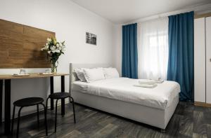 Postel nebo postele na pokoji v ubytování River House Apartments