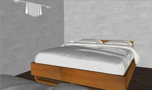 a bed with white sheets and pillows on it at Krabi Boxtel in Krabi town +7 photos