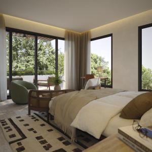 a bedroom with a large bed and large windows at Casa Simona in Valle de Anton