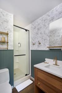 a bathroom with a shower and a sink at The Sagaponack in Sagaponack +49 photos
