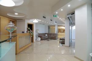 a living room with a couch and a lobby at Perla Hotel e Garden - Free Parking and Pool - Open area with Beautiful view of the Landscape in Capaccio-Paestum +40 photos