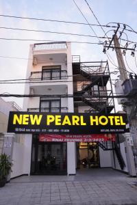 a new pearl hotel building with a new pearl hotel sign at New Pearl Hotel HCM in Ho Chi Minh City