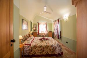 a bedroom with a large bed in a room at Il Mandorlo - Agriturismo e Azienda Agricola Ferrato in Ancona