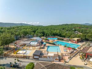 an overhead view of a water park with two pools at Camping Domaine de Chaussy in Lagorce